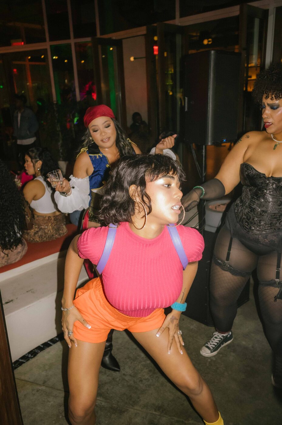 Guest in a Dora costume dancing on the floor