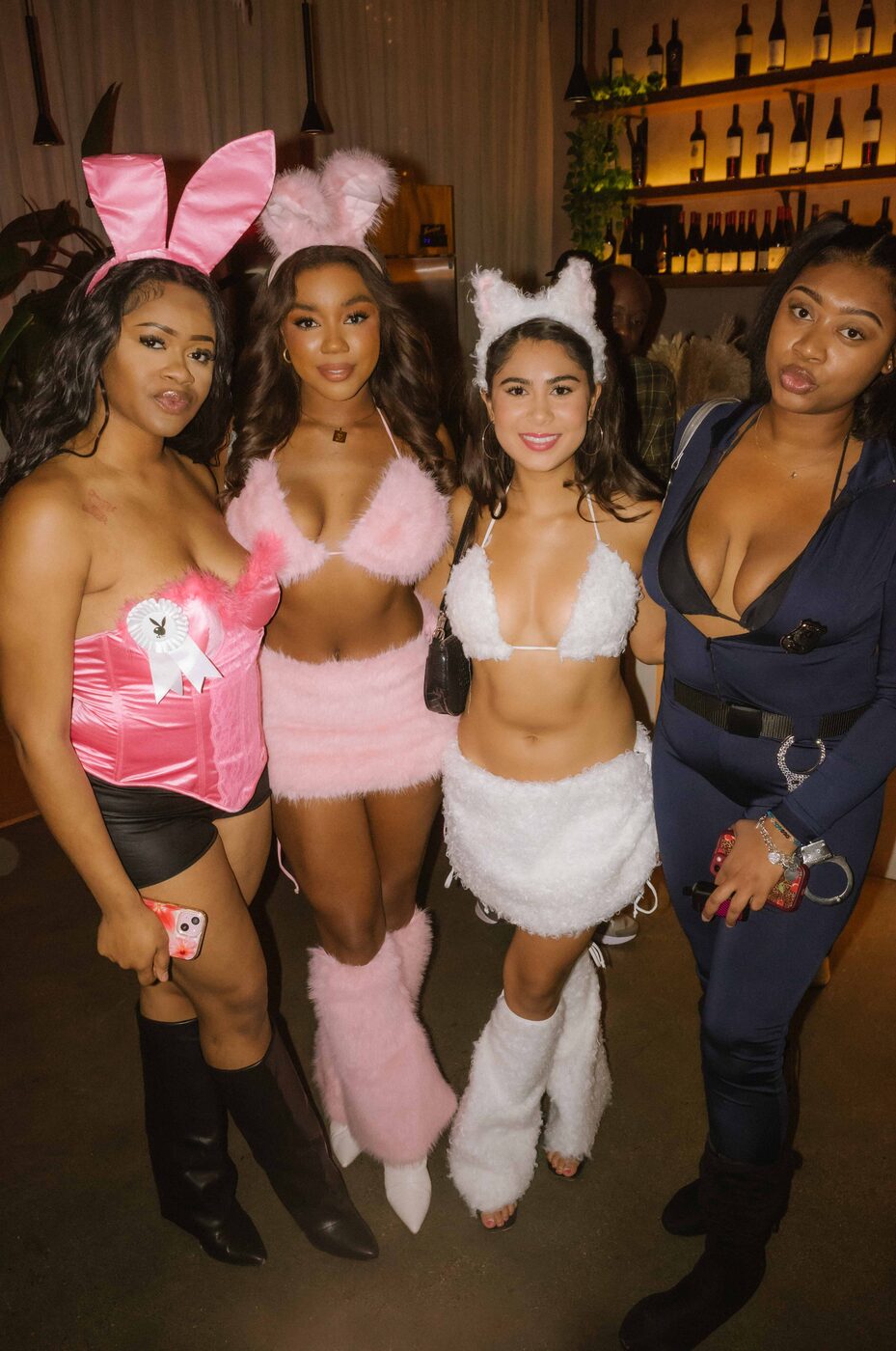 Four guests in bunny, cat and police costumes