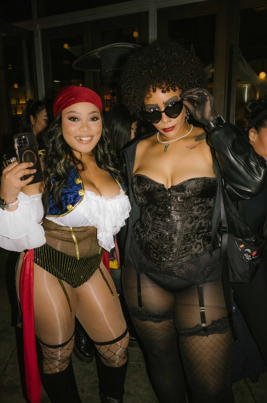 Two guests in pirate and 70s costumes